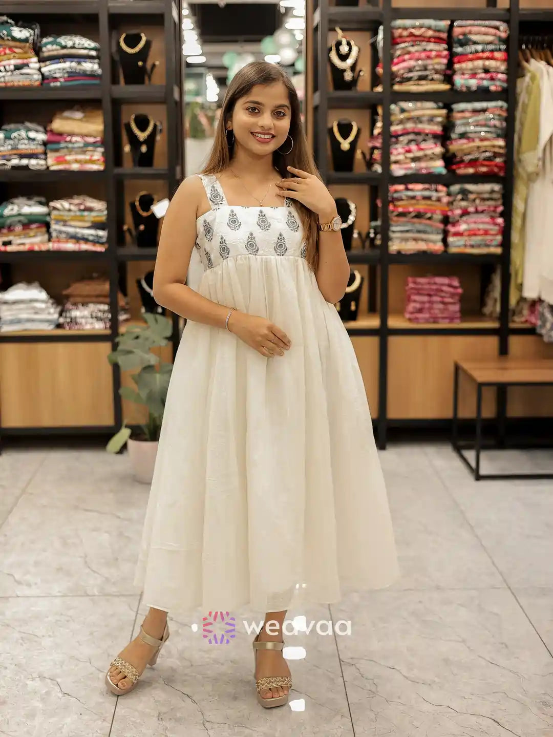 gathered-off-white-sleeveless-frock-for-women-casual-wear