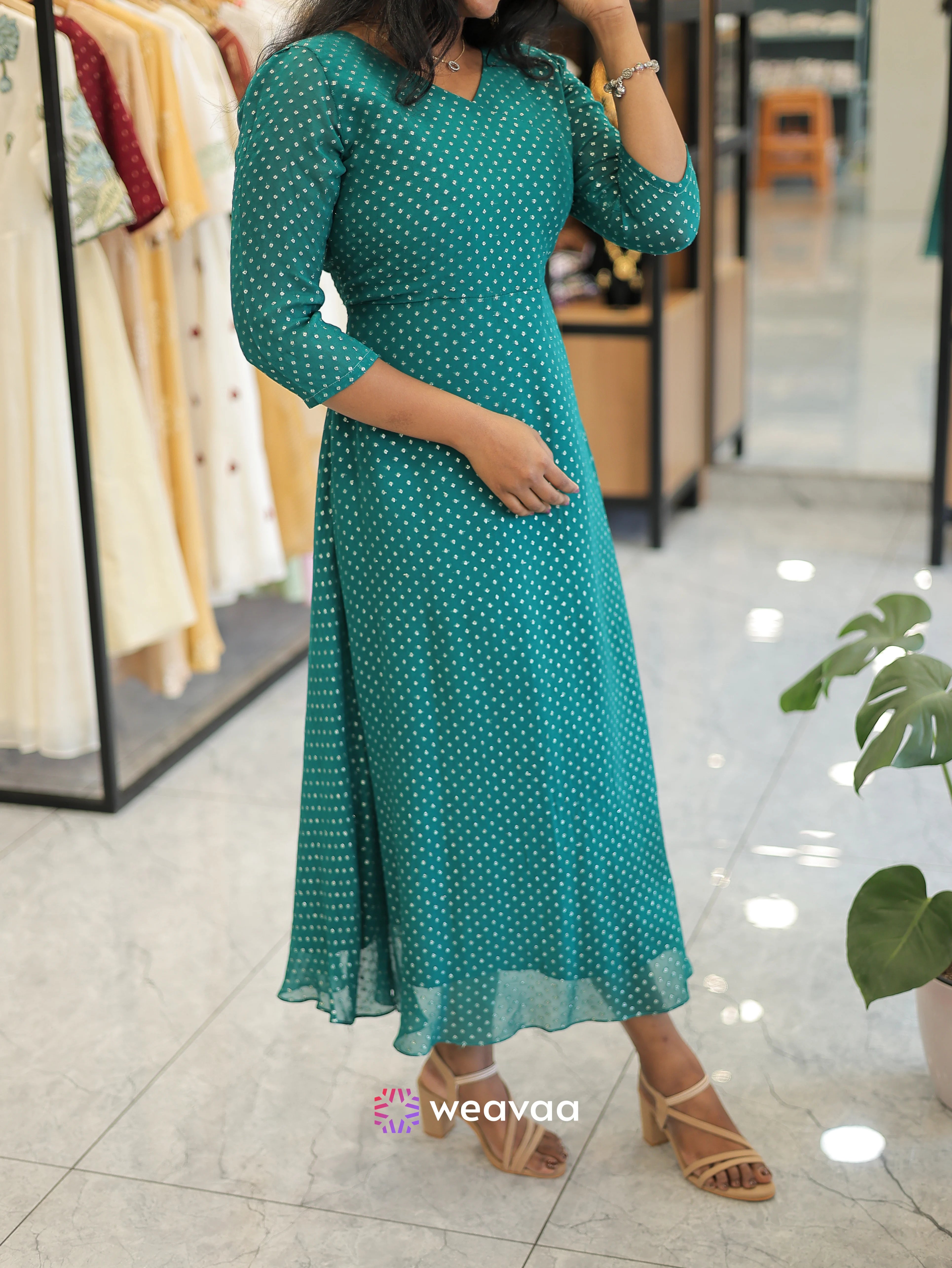 designer-stylish-kurtas-in-peacock-green-color-with-butta-printed-detailing