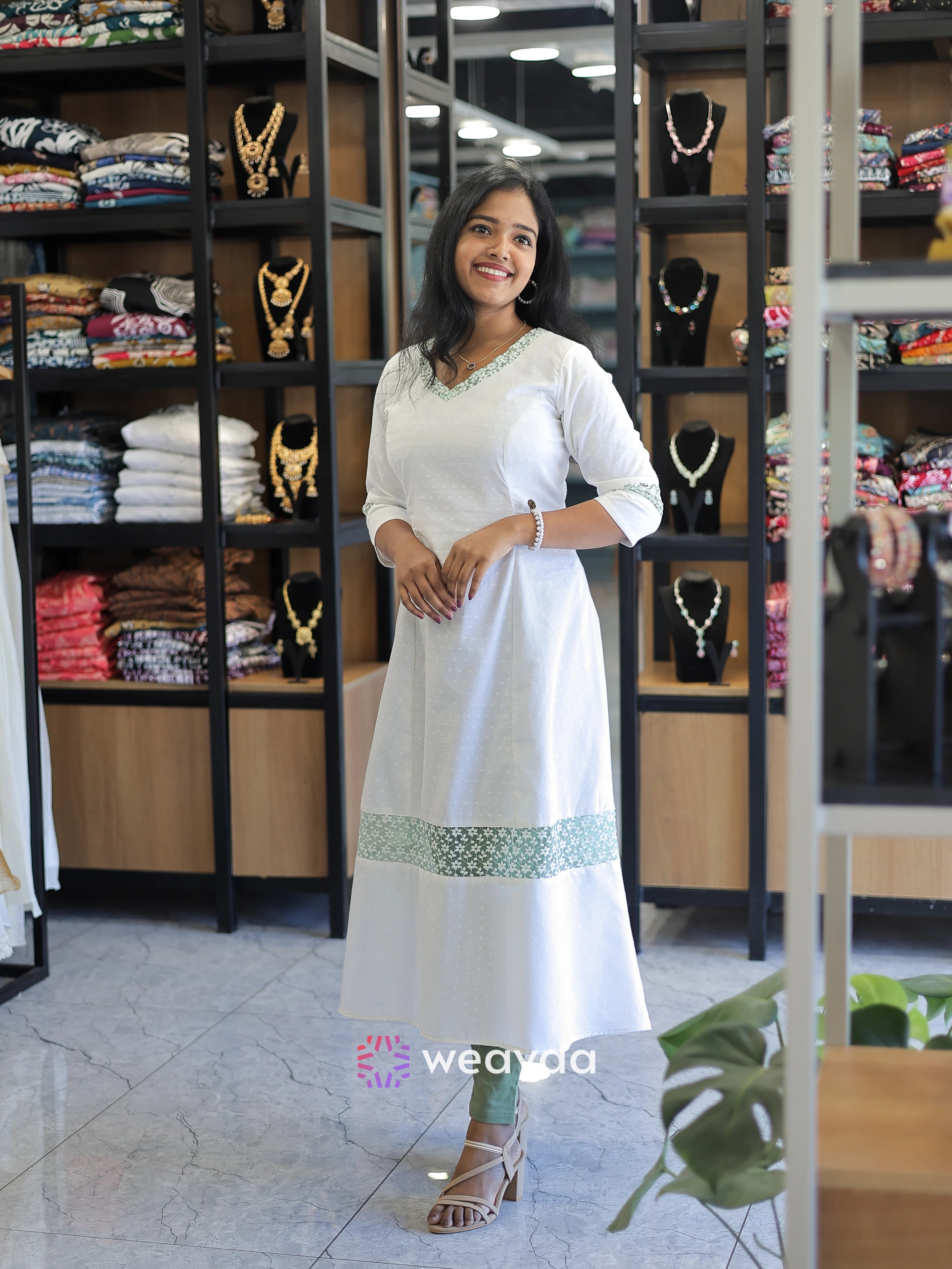 white-cotton-kurta-for-ladies-in-a-line-cut-with-floral-net-detail